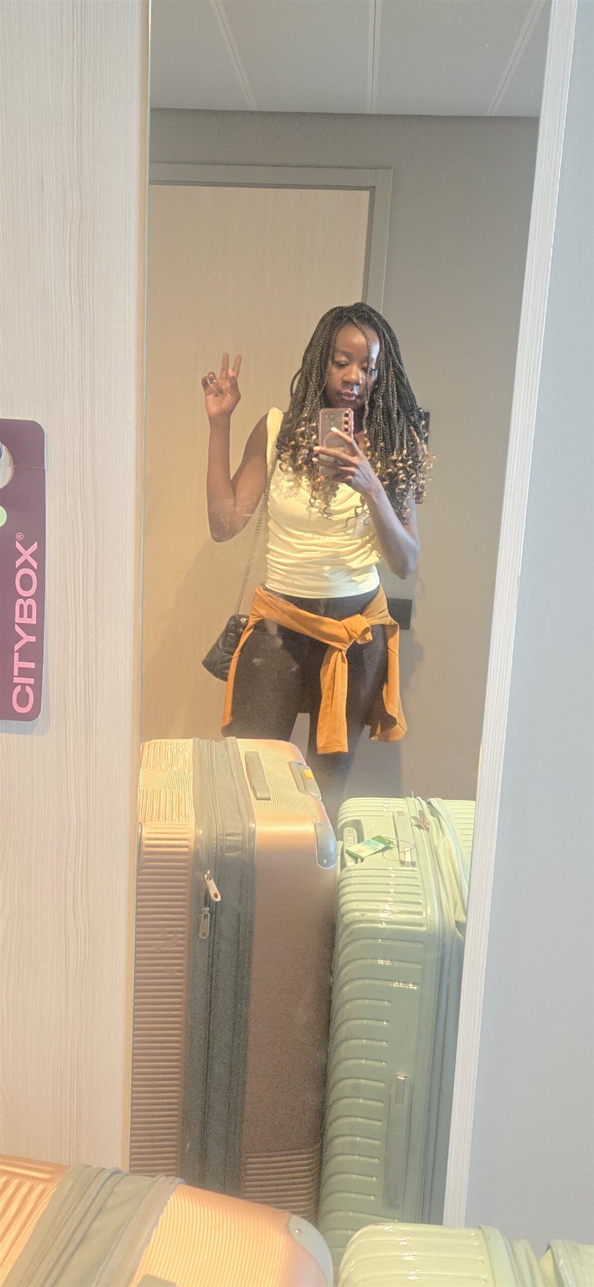A small hotel room with suitcases, hotel or Airbnb with kids