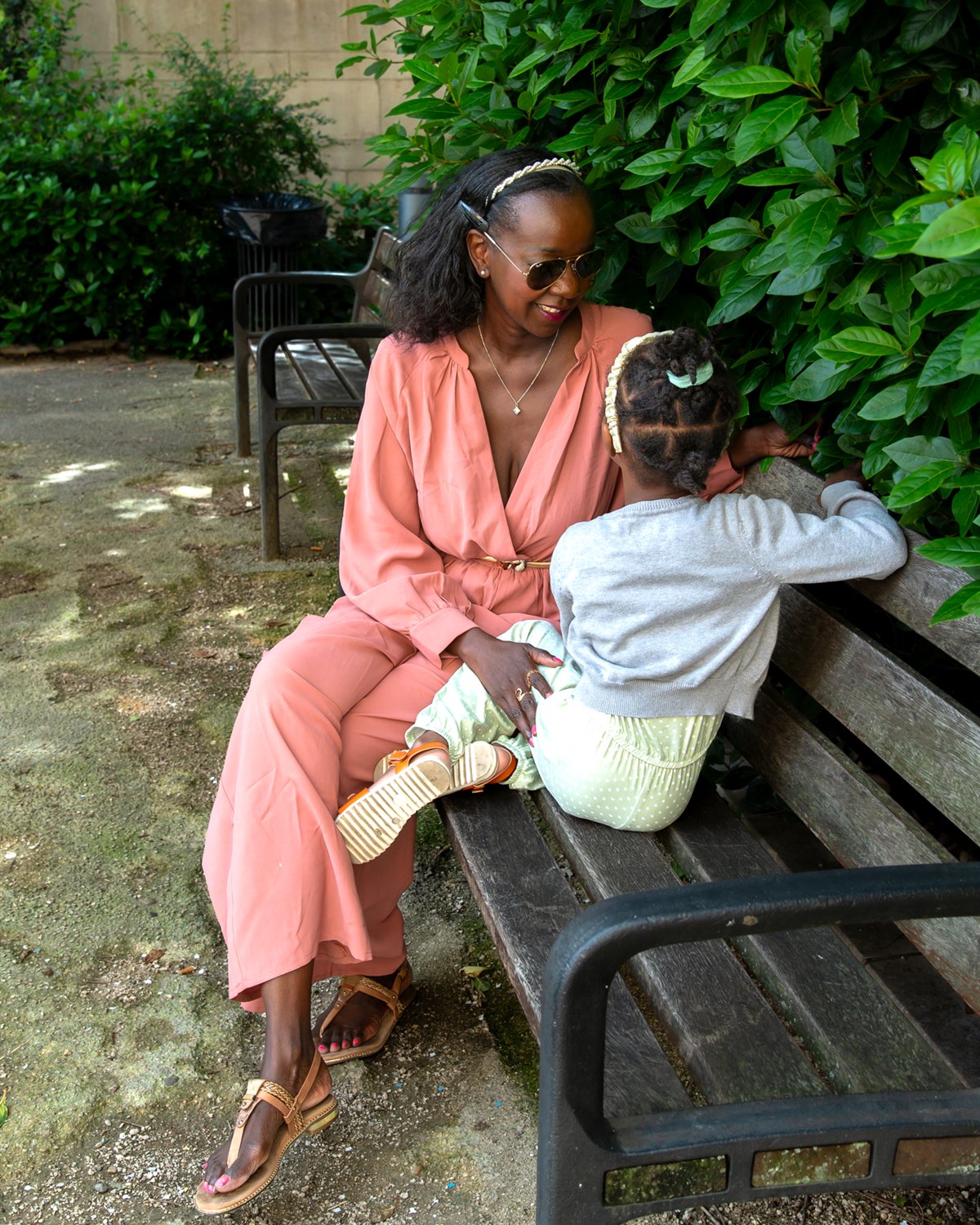 Samira Diallo with her daughter on a bench in Lyon, France
