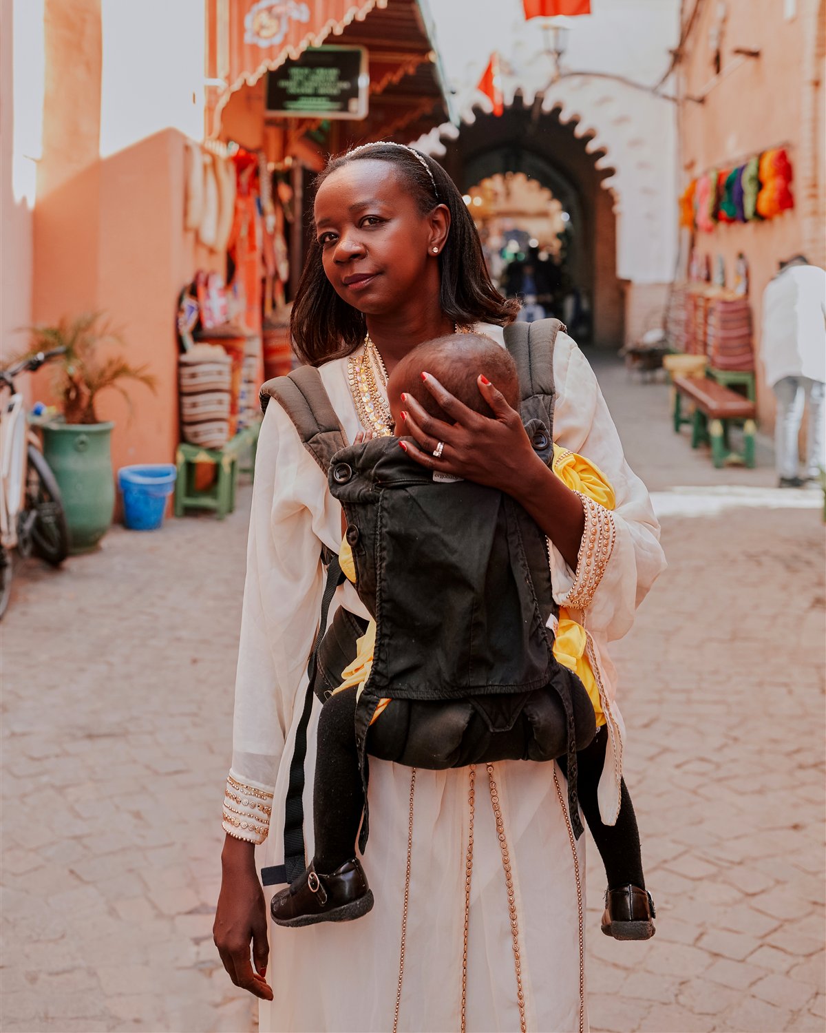 Samira Diallo carrying her baby in Marrakesh, Morocco