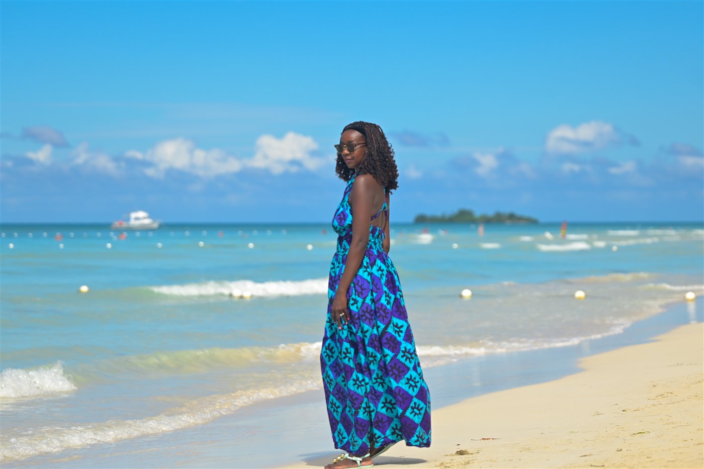 Samira Diallo walking on the beach in Negril, Jamaica