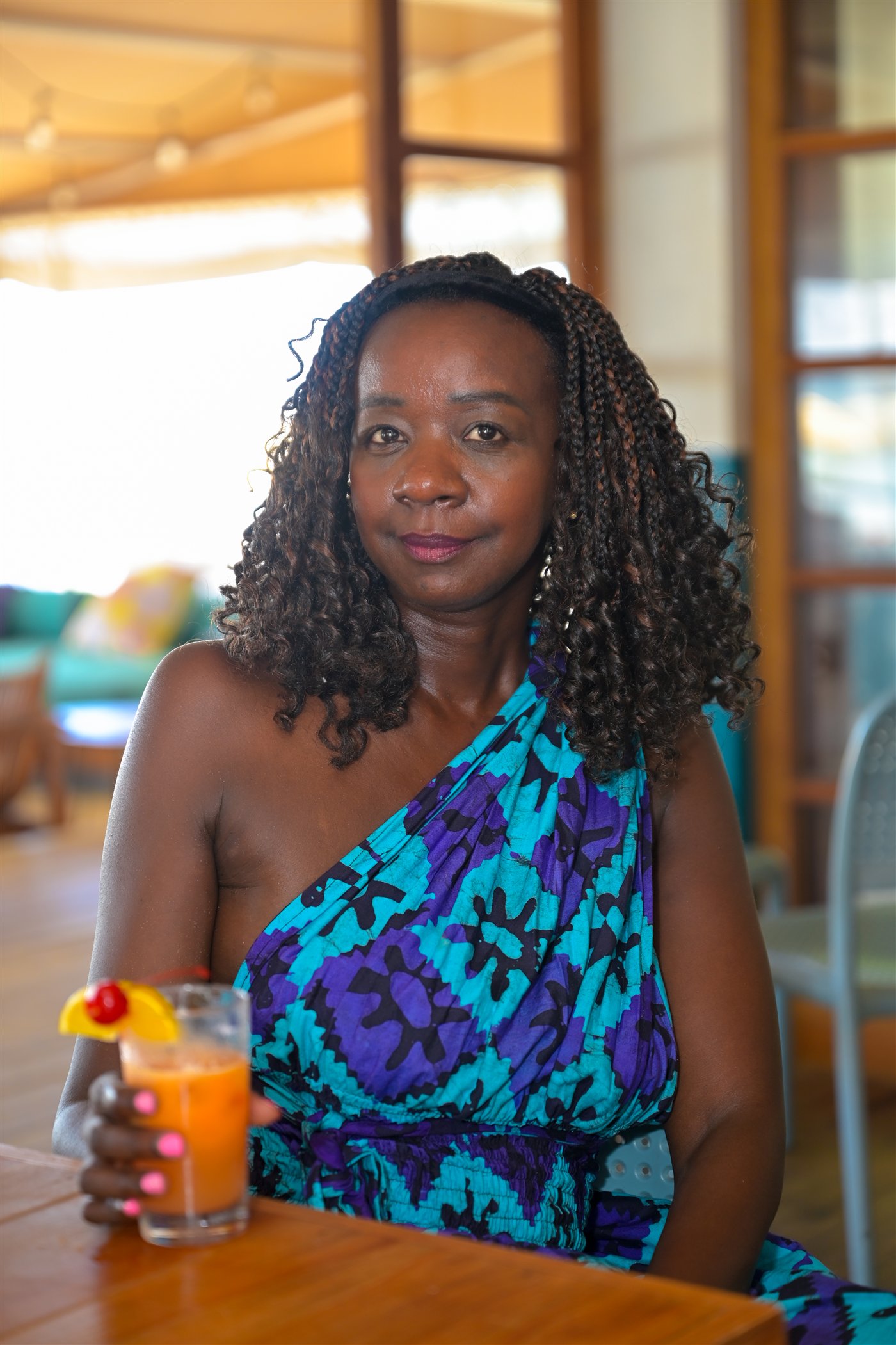 Samira smiling with a fresh juice in Negril